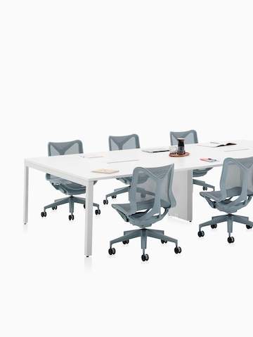 Six-person Layout Studio meeting table with grey low-back Cosm Chairs.