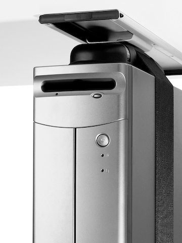 A CPU secured by a strap and attached to the underside of a work surface. Select to go to the Loop CPU Support product page.