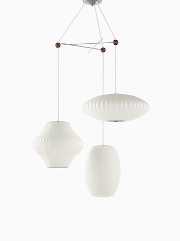 Three white hanging lamps.