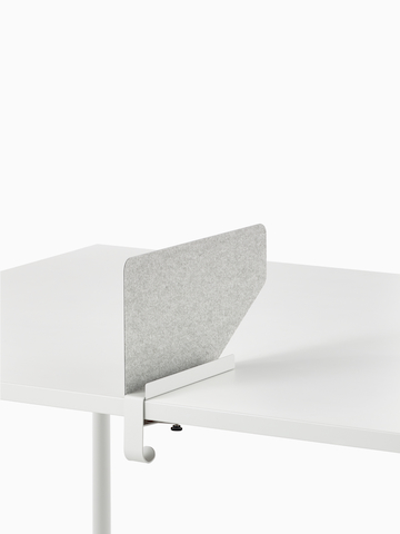 Grey OE1 Boundary Screen with liner on a white OE1 Rectangular Table, viewed from an angle.
