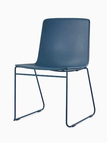 A peacock blue Pronta Stacking Chair with a chrome base and glides.