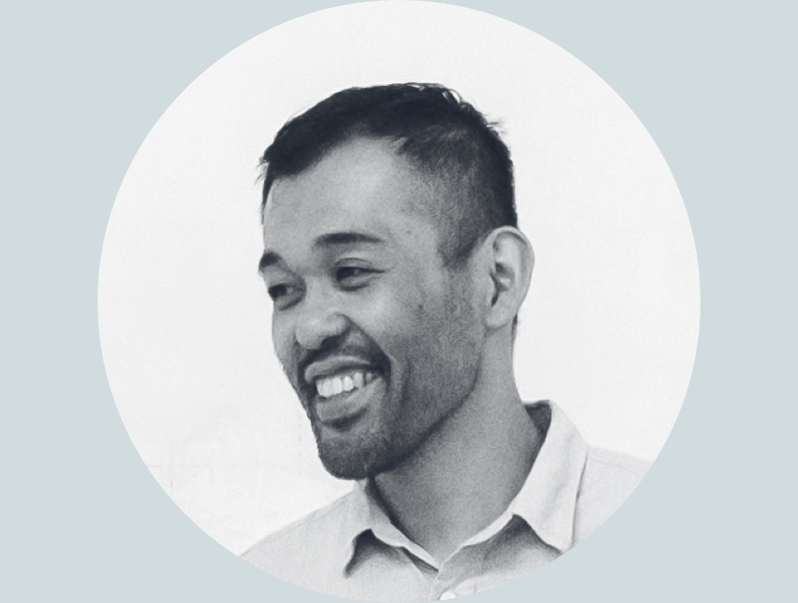 A black and white profile portrait of designer Keiji Takeuchi.