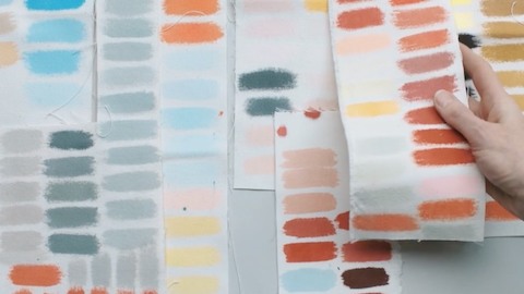 Sheets of color samples. Select to go to an article and video about the colour expertise of designers Stefan Scholten and Carole Baijings.