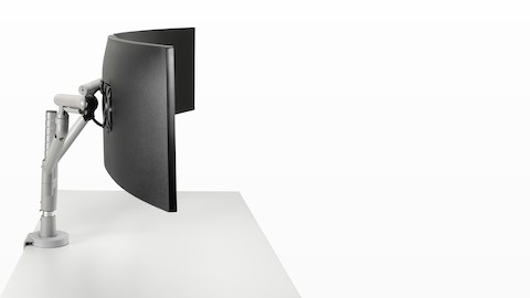 Dual Flo Modular monitor arms in silver, viewed from the side. 