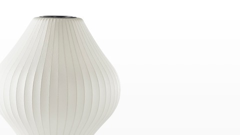 Close view of the white shade on a Nelson Pear Tripod Lamp.