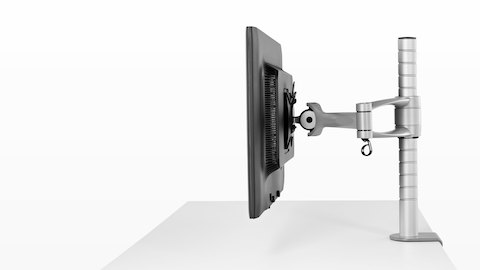 Profile view of a single monitor attached to a Wishbone Monitor Arm post.